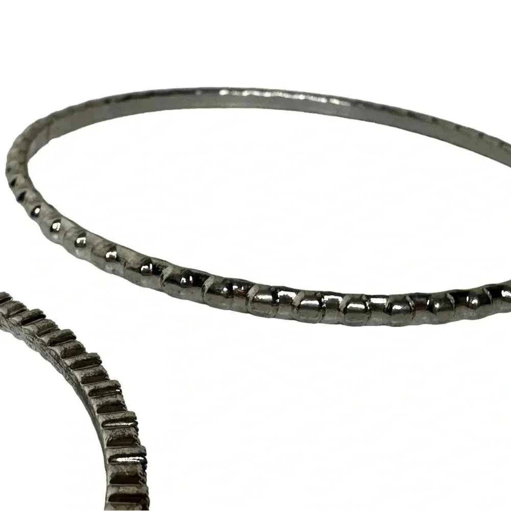 Set of 4 silver bangle bracelets